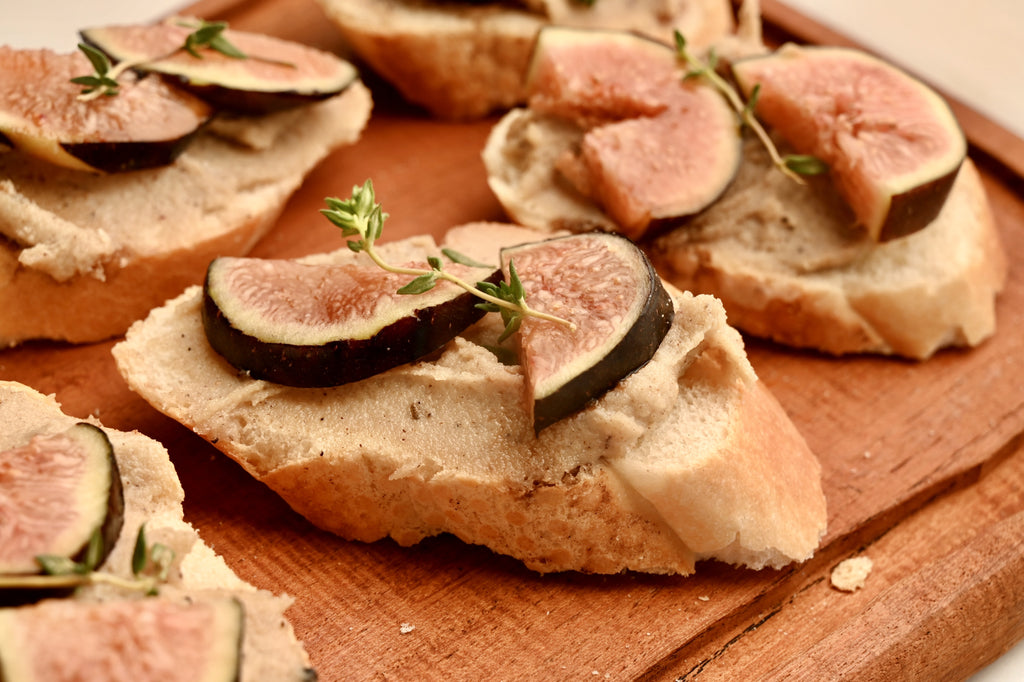 A close up of a slice of fig bruschetta