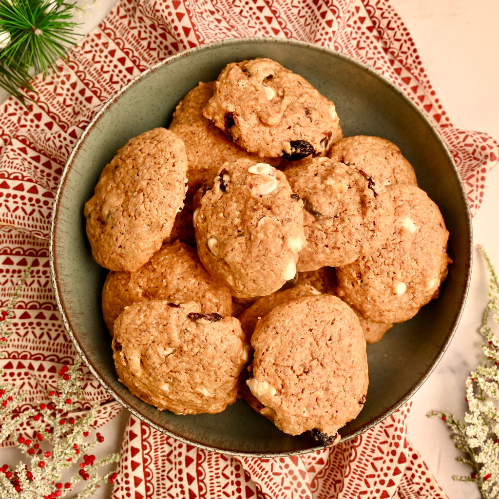 A close up of cranberry cookies on a plate