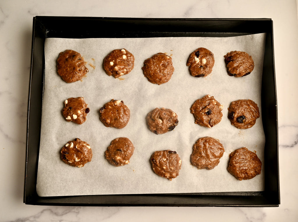 Cranberry cookie dough on a baking sheet