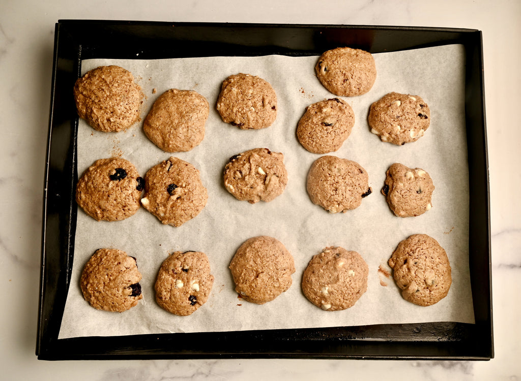 Baked cranberry cookies on a cookie sheet