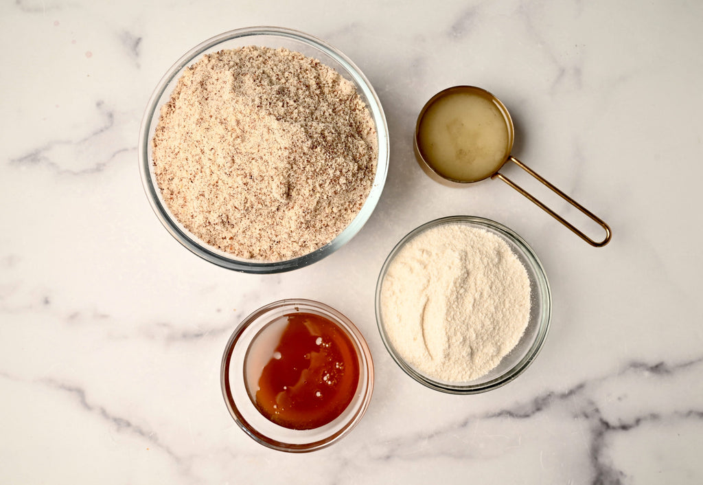 Raw almond flour in a big clear glass bowl