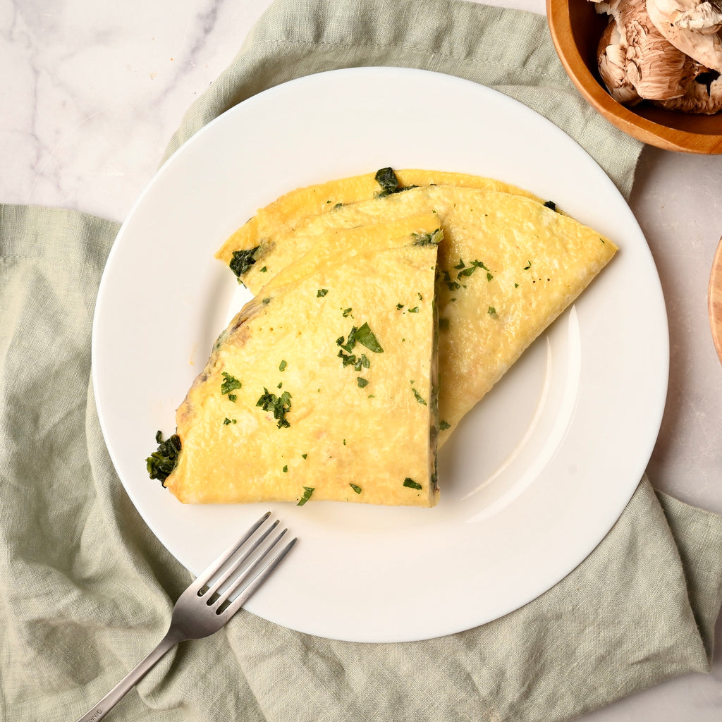 Spinach omelet on a white plate