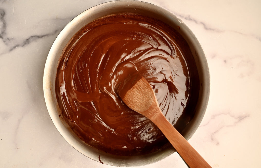 Melted dark chocolate in a mixing bowl