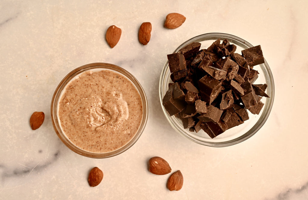 A clear glass bowl filled with nut butter