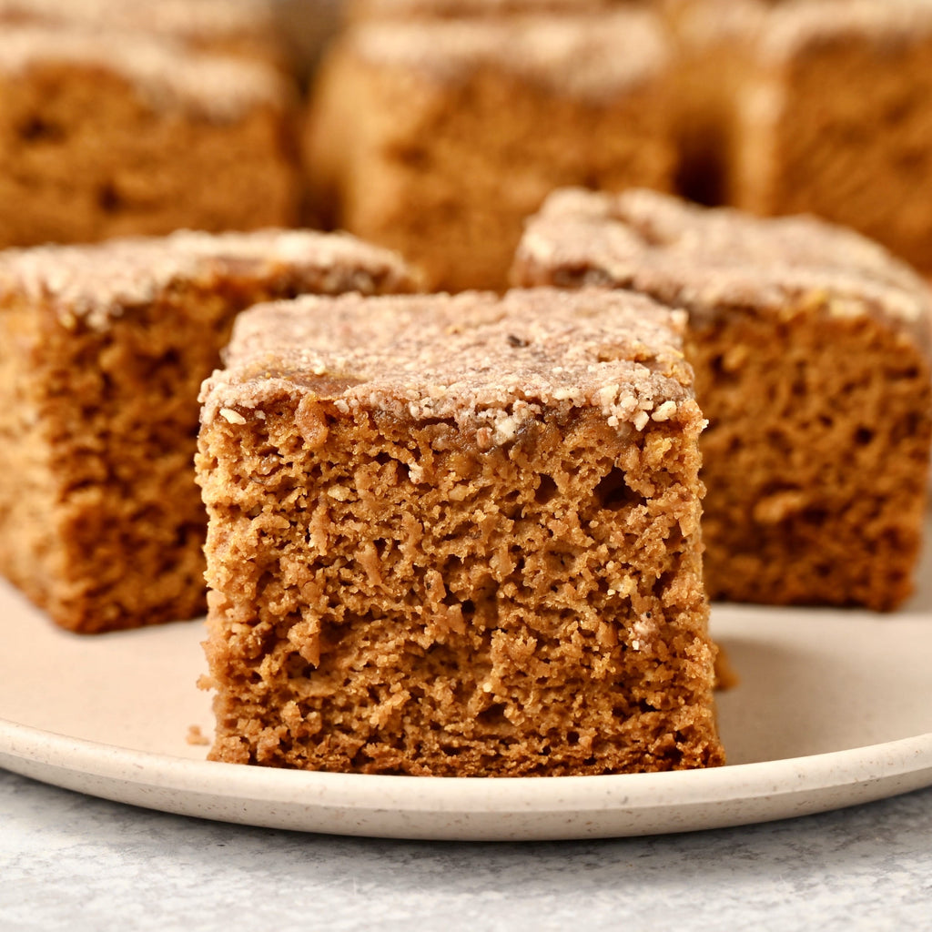 A close up of one slice of pumpkin coffee cake