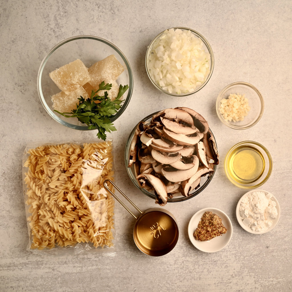 Raw ingredients in clear glass bowls on a kitchen counter