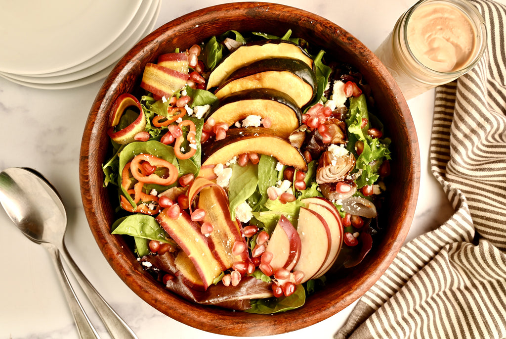 A wooden bowl filled with salad