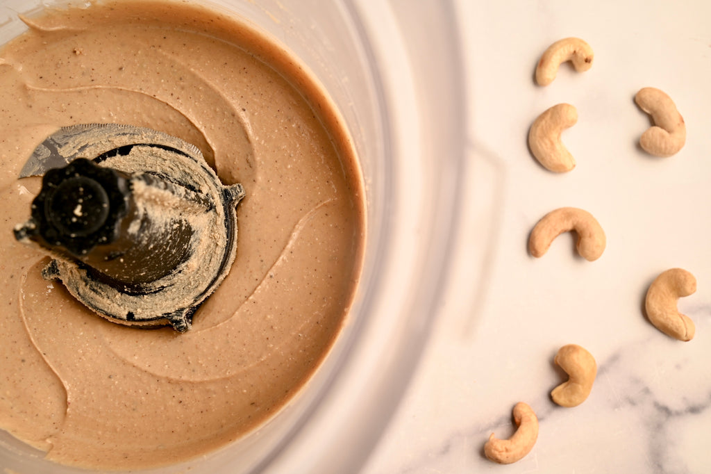 Cashew butter being swirled around in The NutraMilk machine