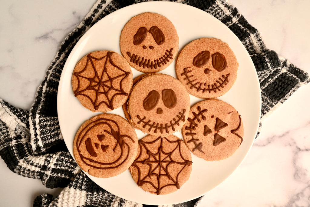 A plate of cookies with Halloween faces