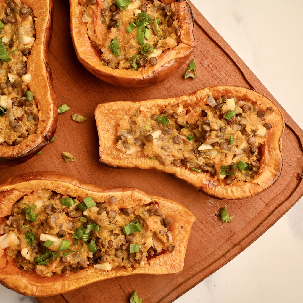 A close up of stuffed roasted butternut squashes