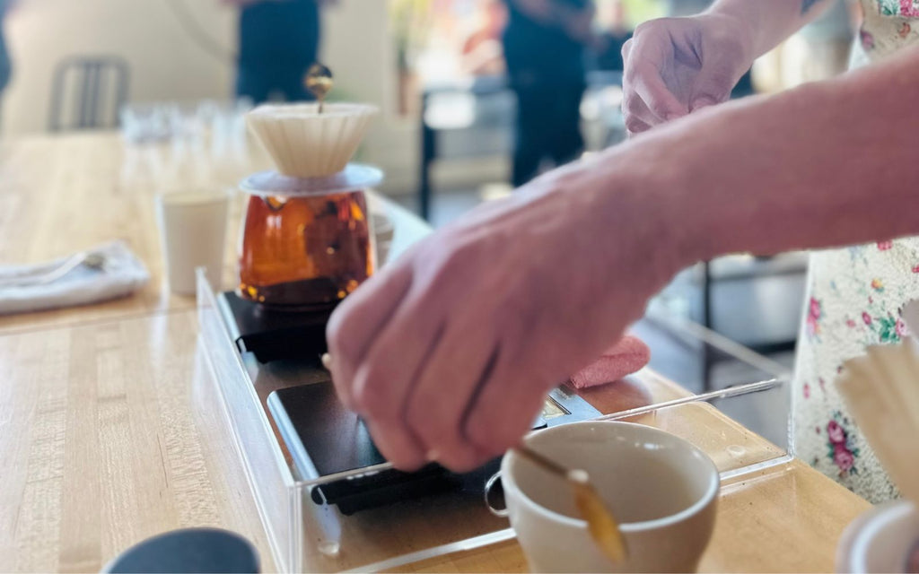 A competitor is brewing coffee at Brewers Cup Preliminary Competition.