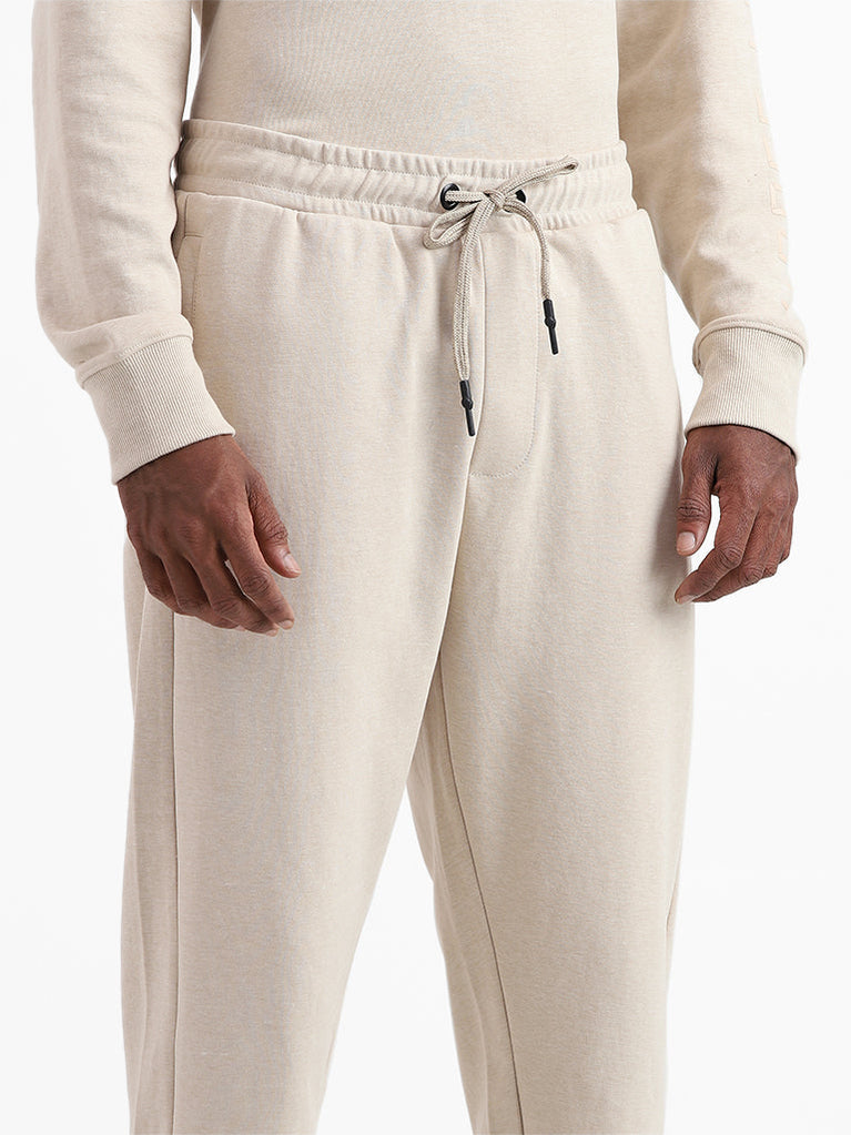 Buy Studiofit Solid Beige Slim Fit Joggers from Westside