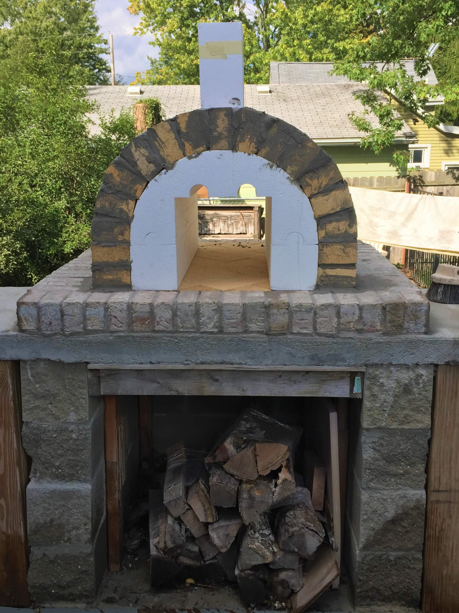 https://cdn.shopify.com/s/files/1/0568/6758/6256/t/9/assets/how-to-build-a-brick-pizza-oven-outdoor-4-BKo_1500x.JPG?v=1666799910