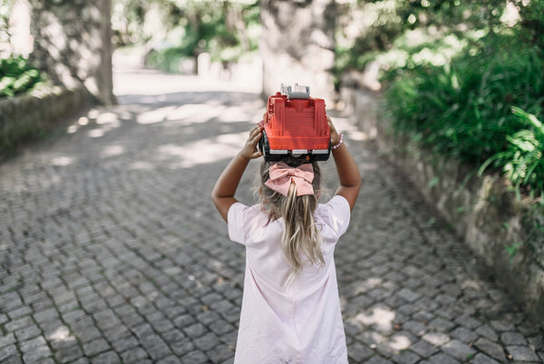 Girl playing with cars, STEm and Non stereotypes for boys and girls. Prisma Kiddos is inspired on STEM and Non Stereotypes to create clothes  for boys and girls