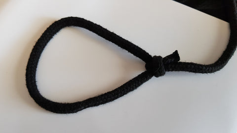 A close up of a wrist loop on a rope dart tether