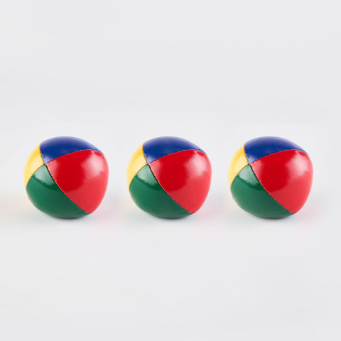 Three brightly coloured juggling balls sit against a white backdrop