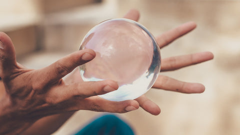 A contact juggler holds their contact juggling ball in their hands