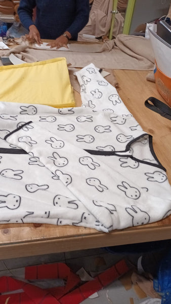 Sleeping bag bunny single-sided with long sleeves on the sewing table