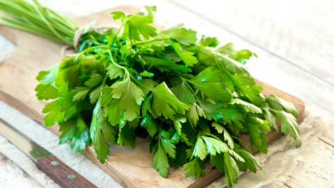 Parsley leaves on a cutting board