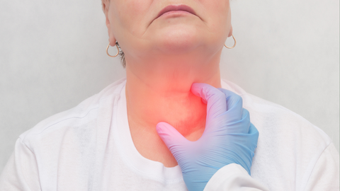 Doctor feels the thyroid gland in a patient of an adult woman, thyroid cancer, close-up, node