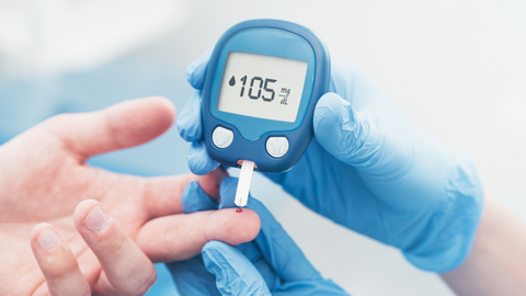 a man is checking his diabetes with a diabetic machine