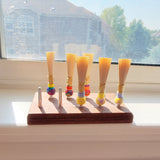 A set of reeds sitting on a windowsill 