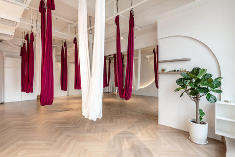 Image of yoga hammocks in a studio room
