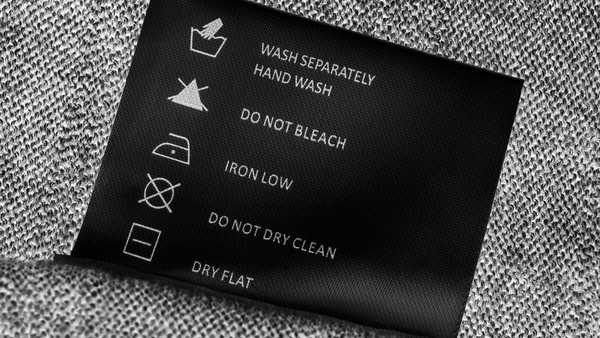 Laundry tag with care instructions symbols