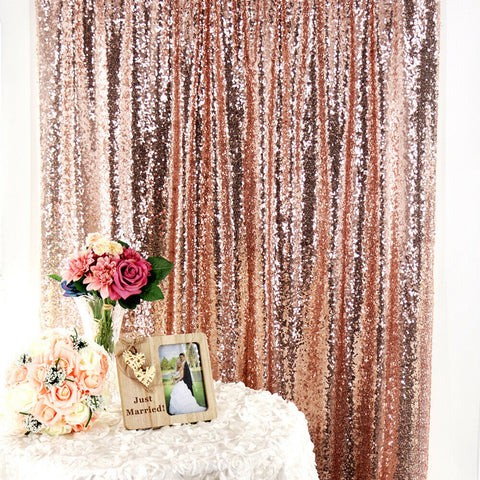 Rose Gold Sequin Wedding Backdrop Curtain Behind A White Table With Wedding Flowers