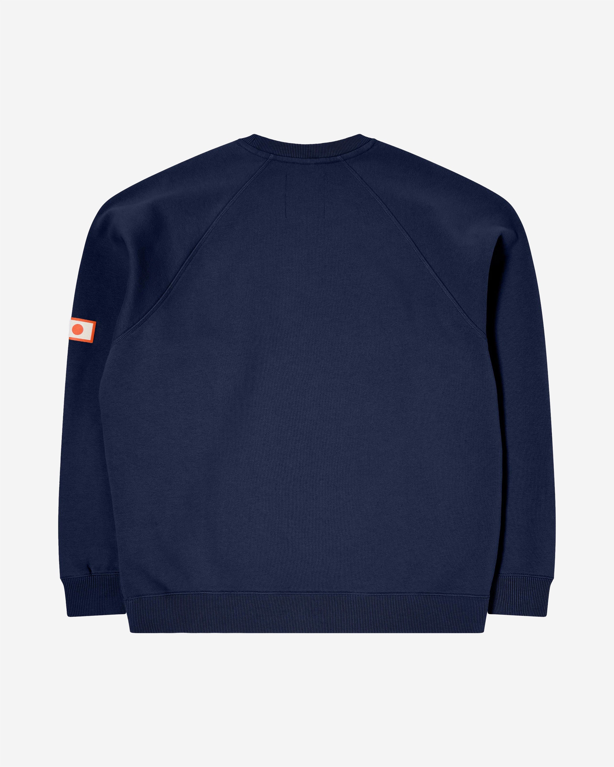 The EDWIN Katakana Retro Sweat is a regular fitted Sweatshirt with orange EDWIN Prints on the Front and the Sleeves. 350g/m² Heavy Brushed Inside Felpa 100% Cotton Oversized Fit Front and Sleeve Prints Rib on Collar Cuffs and Bottom