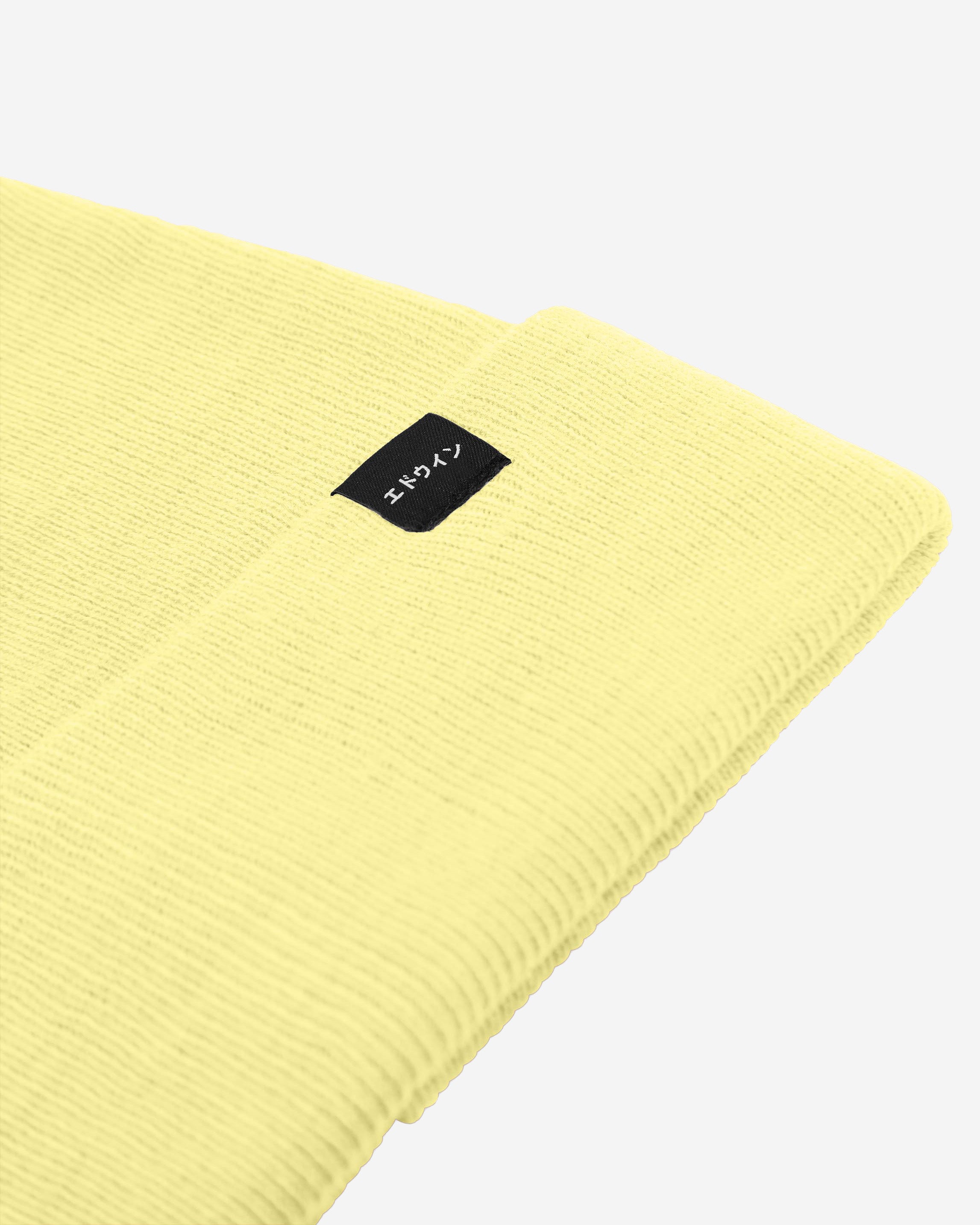 The EDWIN Watch Cap Beanie is a 100% Jersey Acrylic beanie in a yellow colourway Made in Marocco Garment Washed Jersey Knit Double Layer Turn-up part Jersey Knit, 100% Acrylic, 5GG