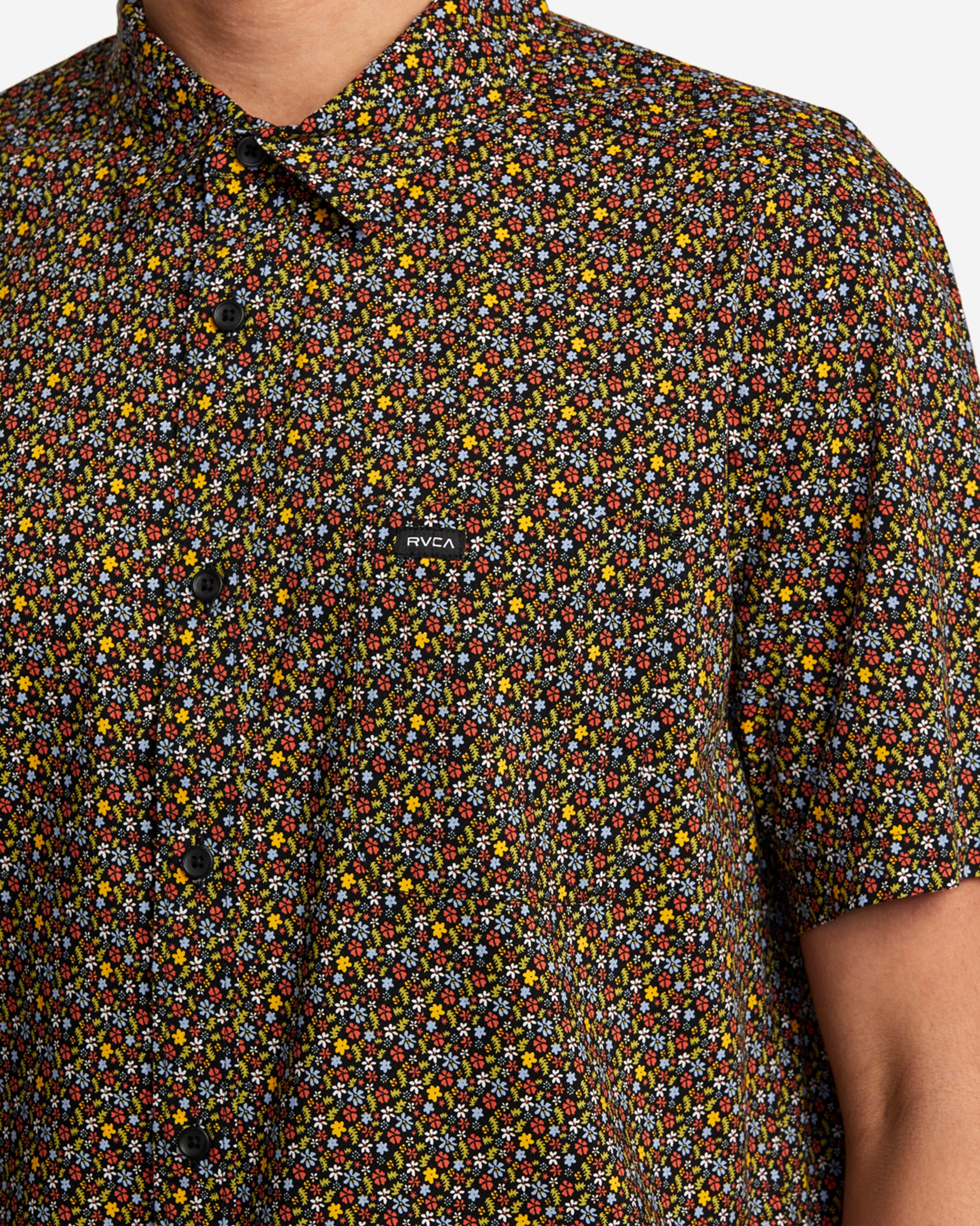 This woven button-down shirt takes a fresh approach to florals with an all-over print on cotton-viscose fabric. The regular fit is styled with a chest pocket and a scalloped hem.