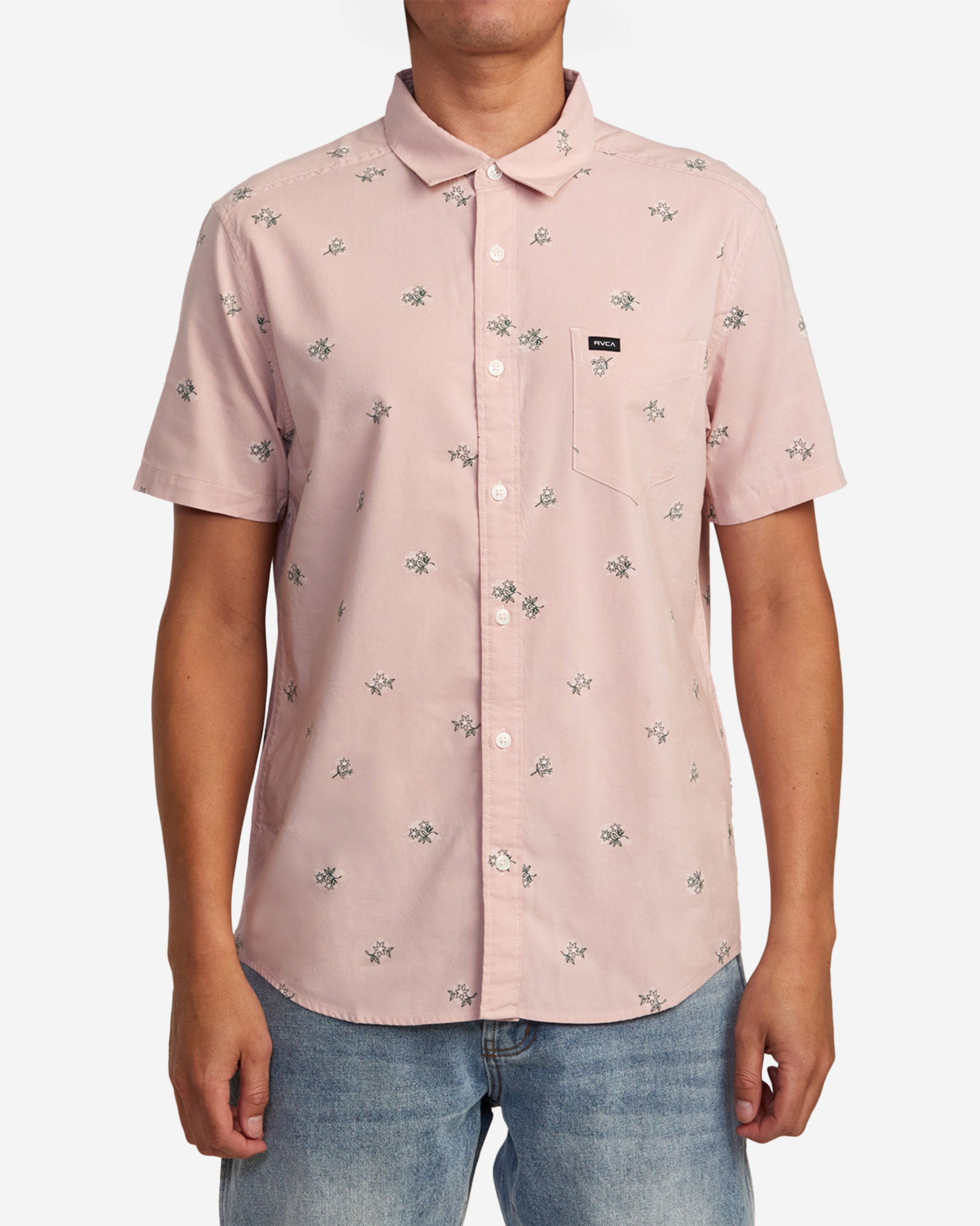 Elevating a classic silhouette with a floral print, this woven button-down shirt is made of cotton-viscose fabric in a regular fit with a chest pocket and a scalloped hem.