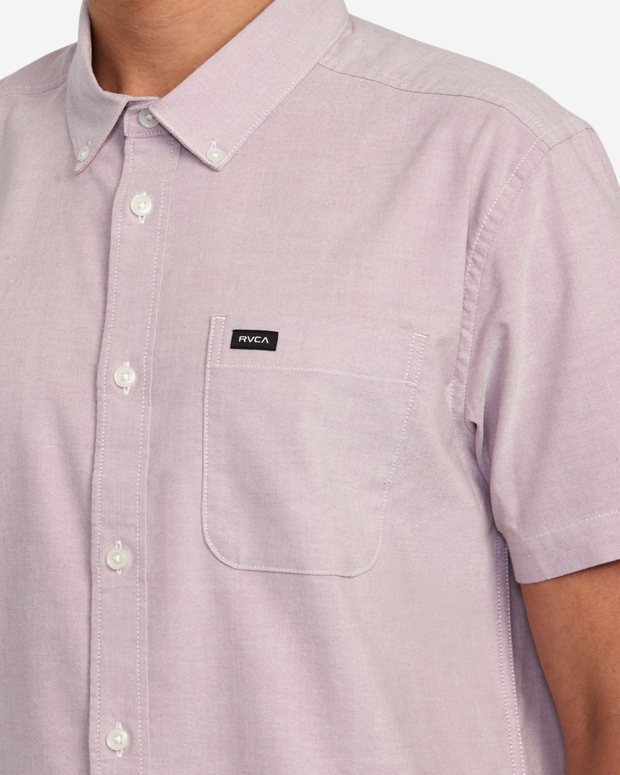 The RVCA That'll Do Stretch Short Sleeve Shirt combines heritage style and modern comfort in one. Made from soft stretch oxford, this button-down shirt features a traditional collar, short sleeves, scalloped hem, chest pocket and woven logo branding.