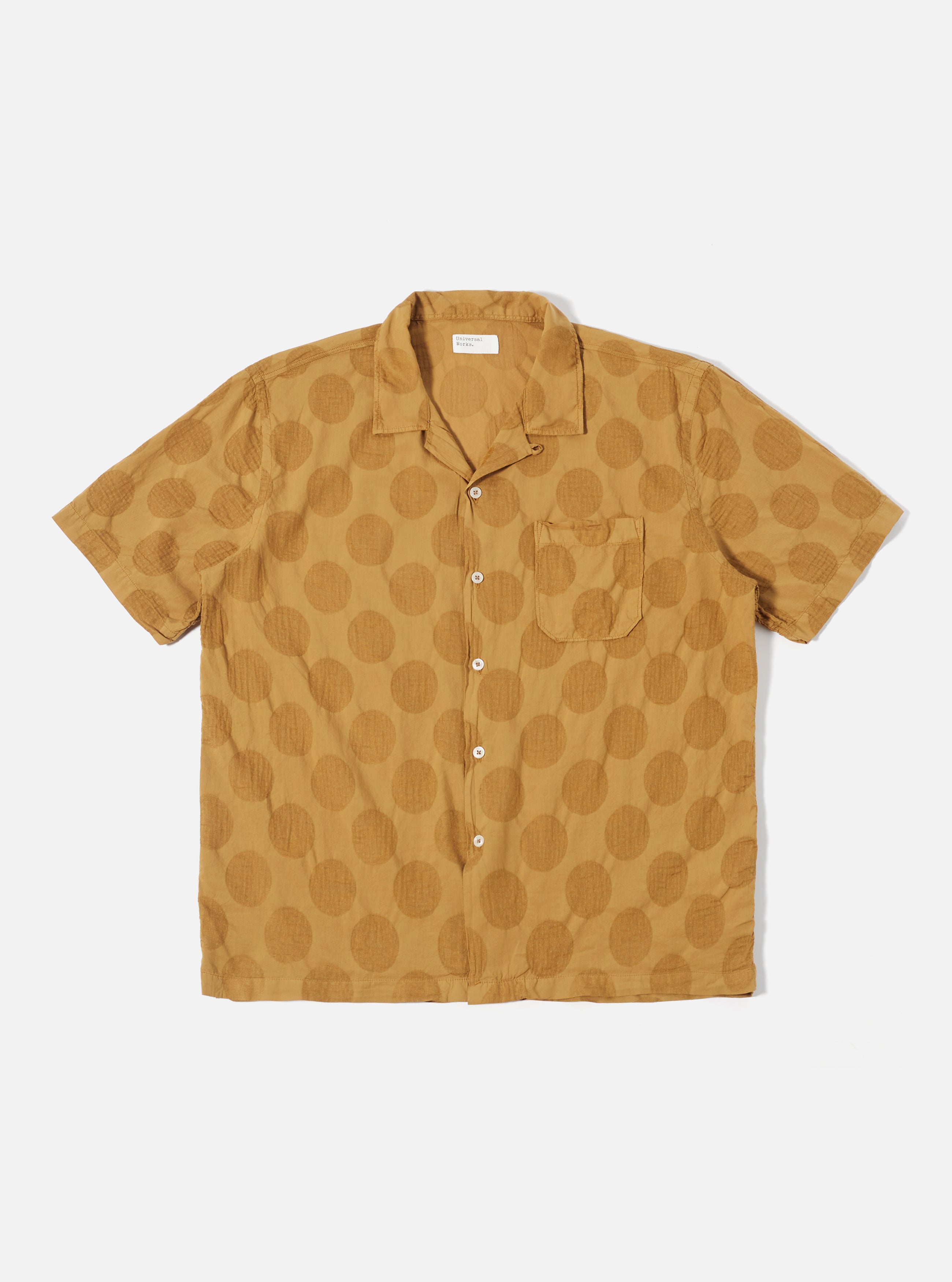 Our classic simple short sleeve summer shirt. Designed to be worn open-necked for a 1950s-style relaxed fit, but has a loop-close top button also. Super-lightweight 100% cotton Italian fabric, over-dyed to reveal a subtle dot pattern in the weave.