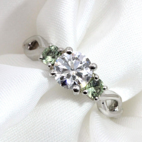 bespoke diamond and green sapphire twisted engagement ring