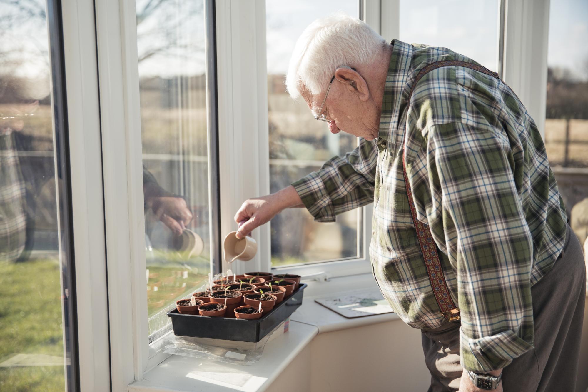 man gardening inside