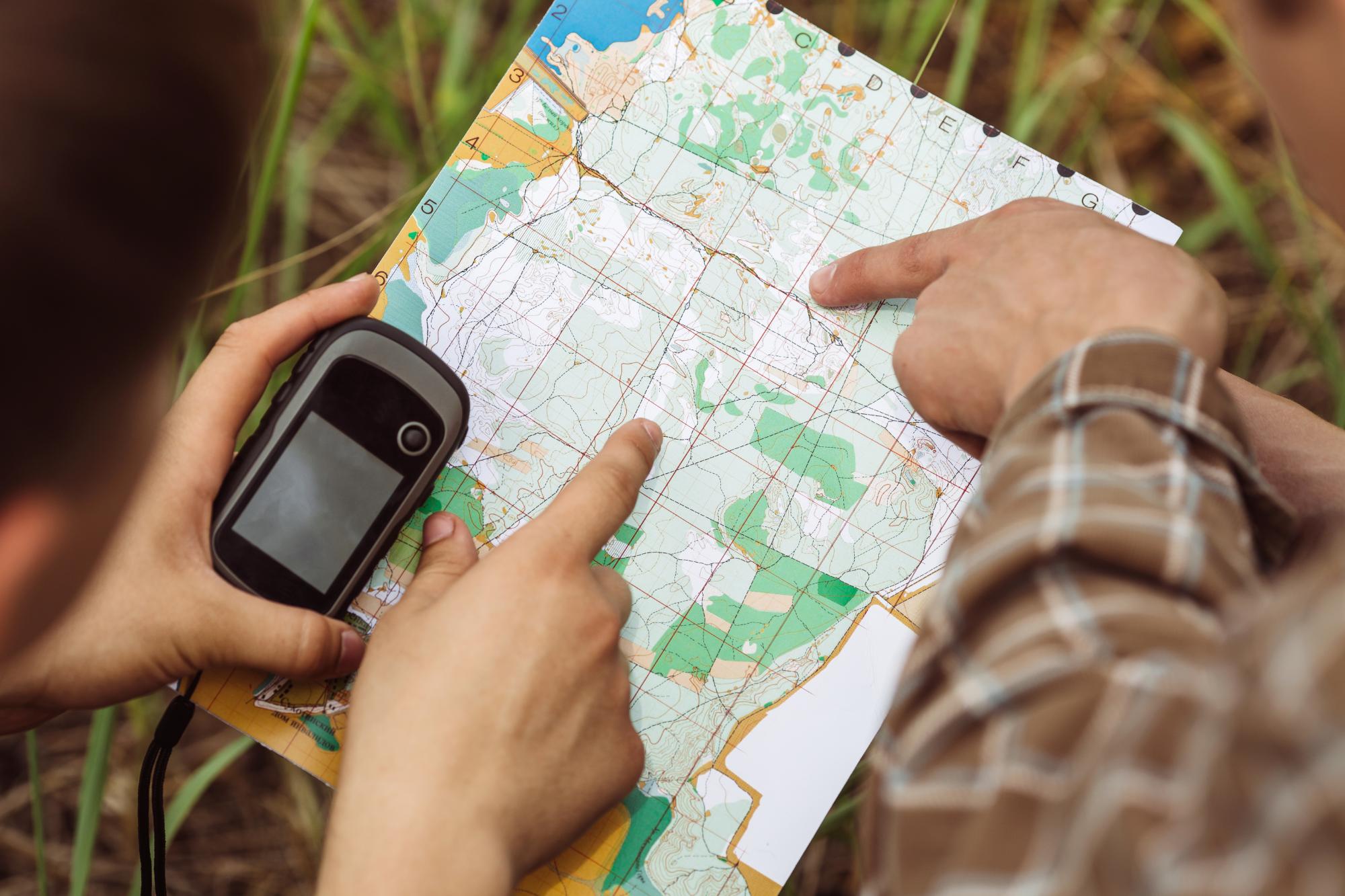 two young tourist determine the route map and navigator