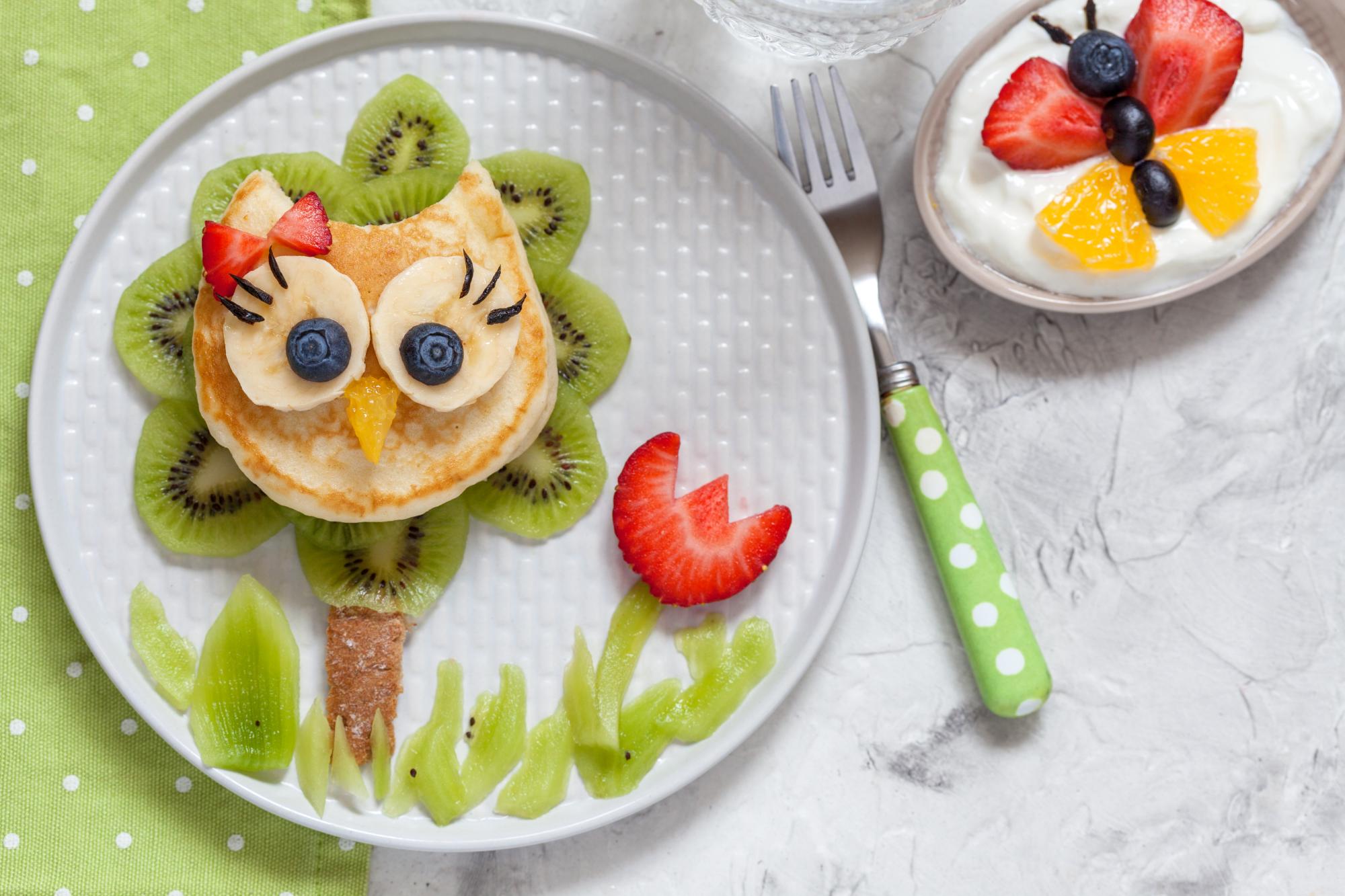 Cute owl pancake with fruits for kids breakfast