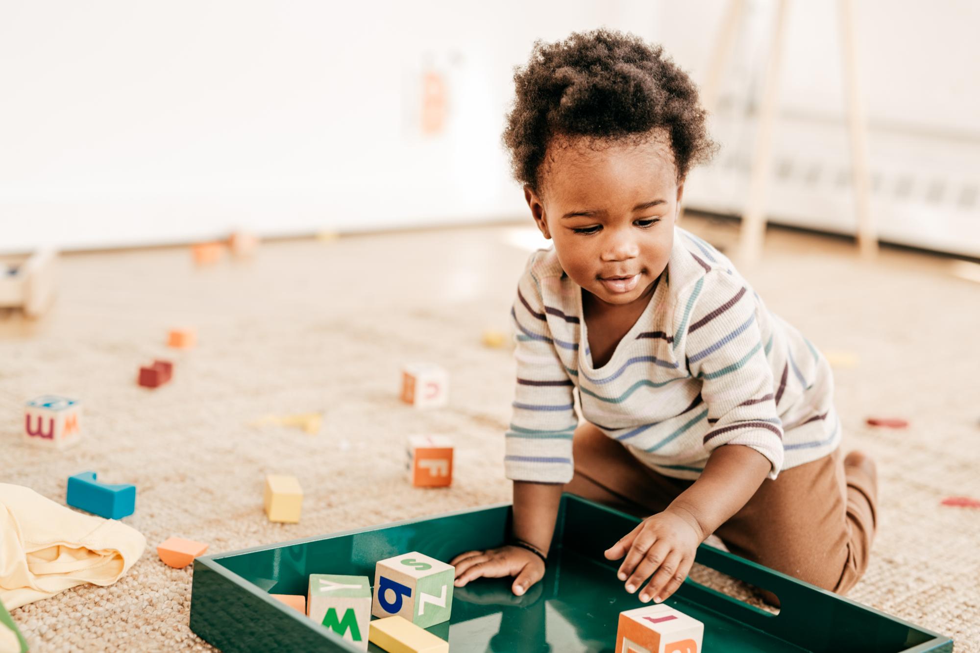 toddler playing with blocks