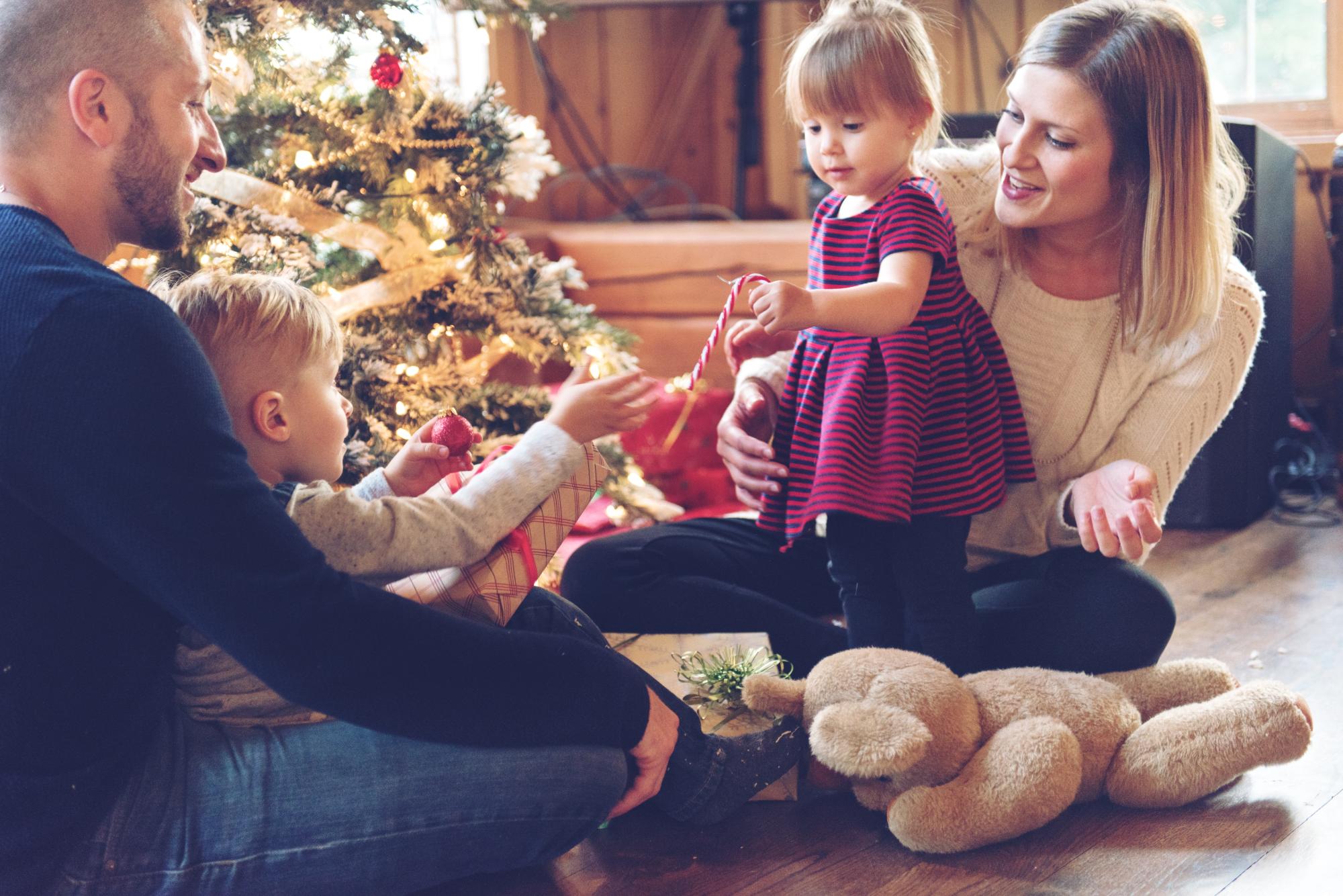 Family decorating the christmas tree