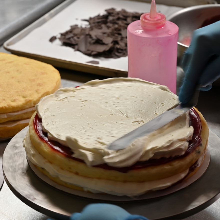 Baker Creating a Raspberry Cake