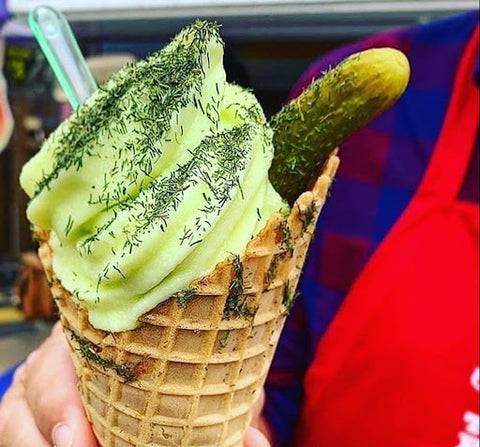 Close up of pickle ice cream in a cone