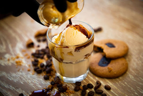 Coffee ice cream in a cup with coffee syrup