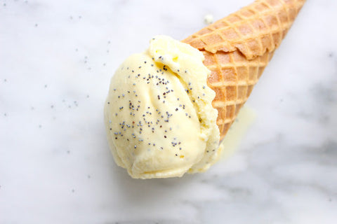 Lemon poppy seed ice cream in a cone