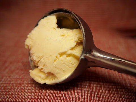 A close up of banana ice cream in scoop