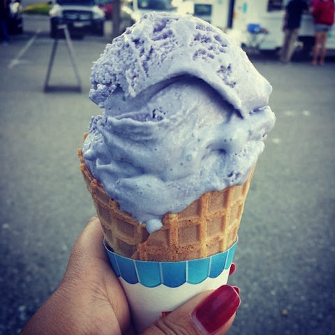 Blue pea ice cream in a cone