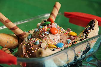 Banana split with sprinkles and wafer stick on top