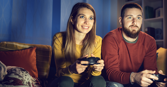 Side view of a professional male using a gaming PC