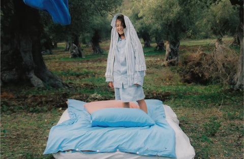 A visual story by artist Agathe Berjaut for Kollekted by x Tekla. Sleepwear, duvet and bedding captured in Olive Fields, Sòller, Mallorca